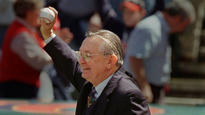 Tribe owner Larry Dolan acknowledges the crowd after catching the first pitch from former owner Dick Jacobs on Opening Day 2000.