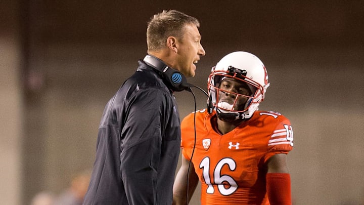 Oct 8, 2016; Salt Lake City, UT, USA; Utah Utes co-offensive coordinator Jim Harding talks to his players during a time out in the first half against the Arizona Wildcats at Rice-Eccles Stadium. Mandatory Credit: Russ Isabella-Imagn Images