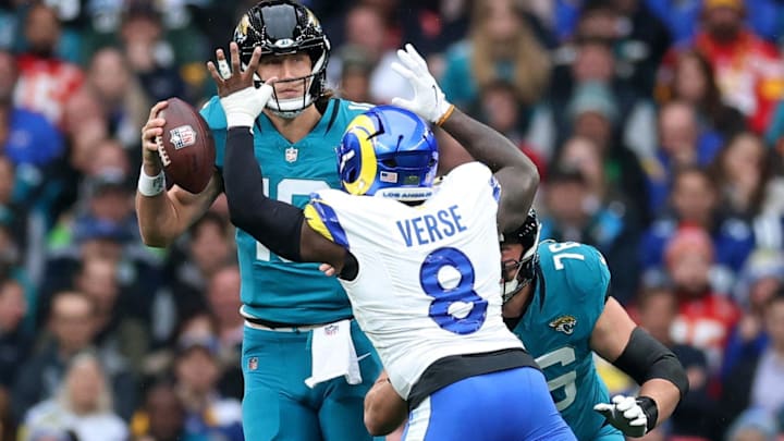 [US, Mexico & Canada customers only] Oct 19, 2025; London, United Kingdom; Los Angeles Rams linebacker Jared Verse (8) defends Jacksonville Jaguars quarterback Trevor Lawrence (16) as Jacksonville Jaguars guard Ezra Cleveland (76) blocks during the first half during a NFL International Series game at Wembley Stadium. Mandatory Credit: Andrew Boyers-Reuters via Imagn Images