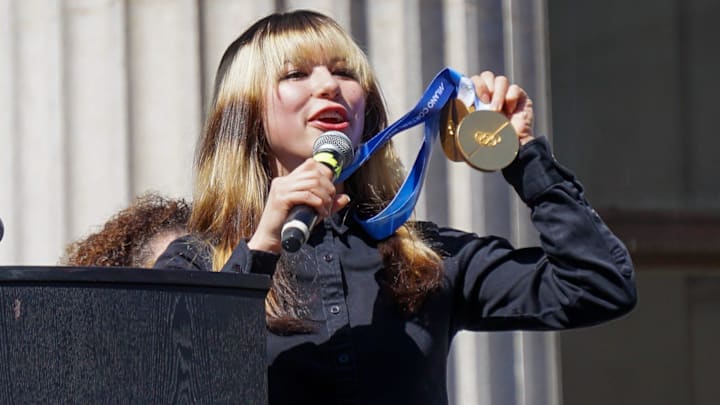 Olympic gold medalist Alysa Liu shows off her two gold medals during the City of Oakland's Alysa Liu celebration rally, on Thursday, March 13, 2026, in Oakland, CA.