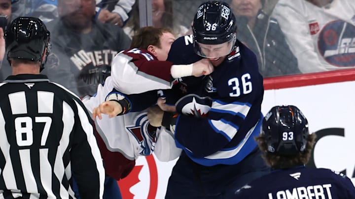 Mar 26, 2026; Winnipeg, Manitoba, CAN; Colorado Avalanche defenseman Josh Manson (42) fights with Winnipeg Jets center Morgan Barron (36) in the third period at Canada Life Centre. Mandatory Credit: James Carey Lauder-Imagn Images Mar 26, 2026; Winnipeg, Manitoba, CAN; Colorado Avalanche defenseman Josh Manson (42) fights with Winnipeg Jets center Morgan Barron (36) in the third period at Canada Life Centre. Mandatory Credit: James Carey Lauder-Imagn Images