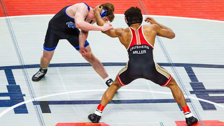 Bishop McCort sophomore Melvin Miller wrestles Warrior Run junior Reagan Milheim during the PIAA state wrestling championships, Saturday, March 8, 2025, at the Giant Center in Hershey.