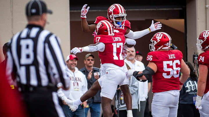 Indiana's Omar Cooper Jr. (3) and Ty Son Lawton (17) celebrate Cooper's touchdown during the Indiana versus Michigan football game at Memorial Stadium on Friday, Nov. 9, 2024.