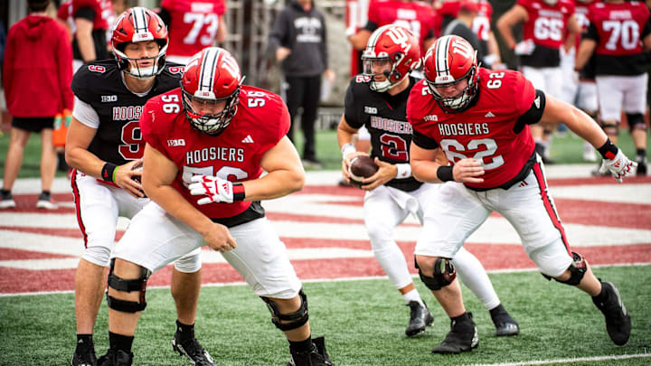 Indiana's Mike Katic (56) and Drew Evans (62) work through a drill during practice at Memorial Stadium. Indiana's Mike Katic (56) and Drew Evans (62) work through a drill during practice at Memorial Stadium.