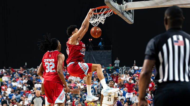Dallas David W. Carter's Terrell Jackson throws down a two-handed dunk in the UIL Class 4A Division 1 championship game on Friday night in San Antonio.