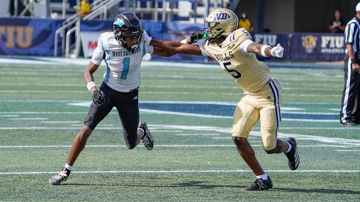 West Broward wide receiver Amir Sears (1) runs a route against West Boca cornerback Jaydin Broadnax (5) in the second quarter of the 6A State Final at Pitbull Stadium on Dec. 12, 2025, in Miami, FL.