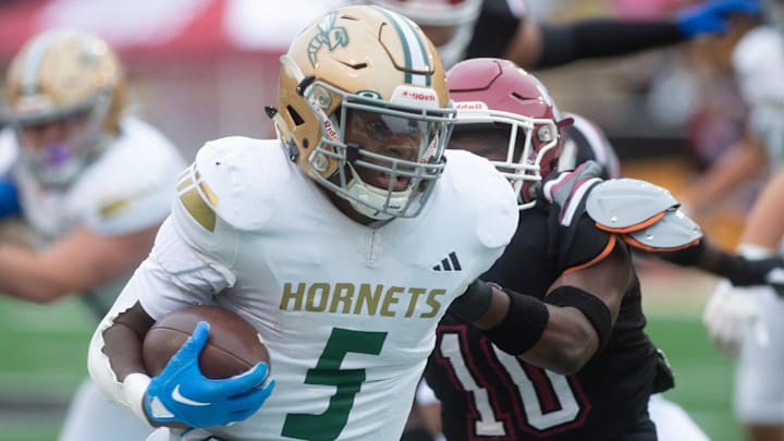 Poplarville's Tylan Keys (5) carries for yardage against Louisville during the MHSAA 4A championship game in Hattiesburg, Miss., Saturday, Dec. 7, 2024. Poplarville's Tylan Keys (5) carries for yardage against Louisville during the MHSAA 4A championship game in Hattiesburg, Miss., Saturday, Dec. 7, 2024.
