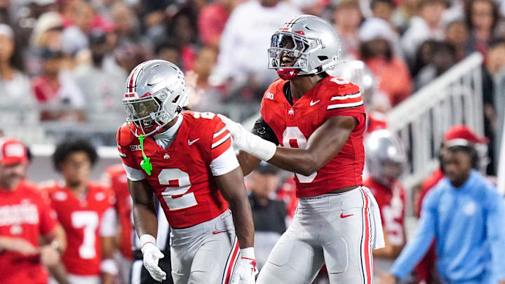 Ohio State Buckeyes safety Caleb Downs (2) and linebacker Sonny Styles (0) celebrate