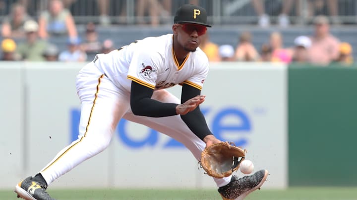Jul 2, 2025; Pittsburgh, Pennsylvania, USA;  Pittsburgh Pirates third baseman Ke'Bryan Hayes (13) fields a ground ball for an out against St. Louis Cardinals third baseman Thomas Saggese (not pictured) during the sixth inning at PNC Park. Mandatory Credit: Charles LeClaire-Imagn Images