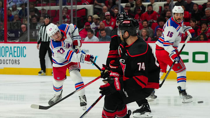 Mar 12, 2024; Raleigh, North Carolina, USA; New York Rangers defenseman Adam Fox (23) takes a shot