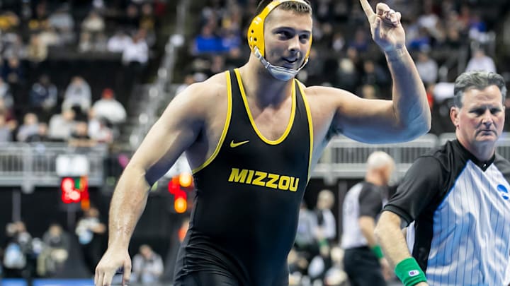 Mar 21, 2024; Kansas City, MO, USA;  Zach Elam of Missouri celebrates his victory over Josiah Hill of Little Rock during the Men’s Division I NCAA Wrestling Championships at T-Mobile Center. Mandatory Credit: Nick Tre. Smith-Imagn Images