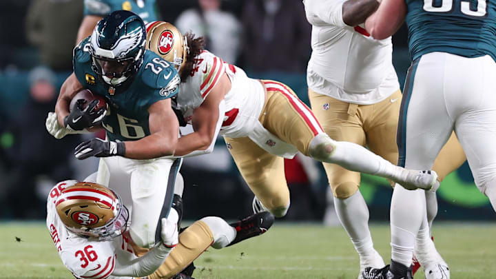 Jan 11, 2026; Philadelphia, PA, USA; San Francisco 49ers safety Marques Sigle (36) and linebacker Eric Kendricks (43) tackle Philadelphia Eagles running back Saquon Barkley (26) during the second quarter in an NFC Wild Card Round game at Lincoln Financial Field. Mandatory Credit: Bill Streicher-Imagn Images Jan 11, 2026; Philadelphia, PA, USA; San Francisco 49ers safety Marques Sigle (36) and linebacker Eric Kendricks (43) tackle Philadelphia Eagles running back Saquon Barkley (26) during the second quarter in an NFC Wild Card Round game at Lincoln Financial Field. Mandatory Credit: Bill Streicher-Imagn Images