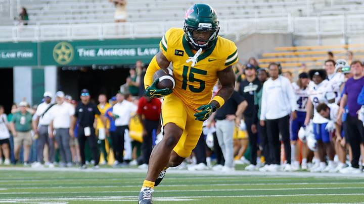 Sep 19, 2026; Waco, Texas, USA; Baylor Bears wide receiver Jayden McGowan (15) breaks away from Louisiana Tech Bulldogs defensive back Sam Fongang (1) on a touchdown reception during the second half at McLane Stadium. Mandatory Credit: Chris Jones Sep 19, 2026; Waco, Texas, USA; Baylor Bears wide receiver Jayden McGowan (15) breaks away from Louisiana Tech Bulldogs defensive back Sam Fongang (1) on a touchdown reception during the second half at McLane Stadium. Mandatory Credit: Chris Jones