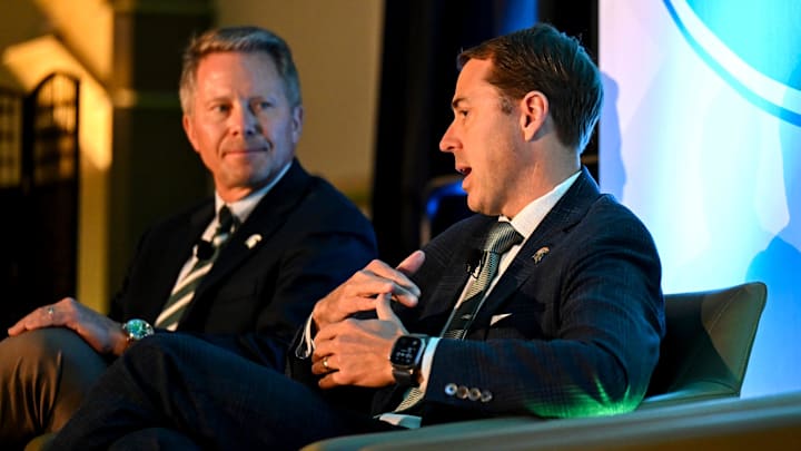 Michigan State University Athletic Director J Batt, right, speaks on stage with MSU President Kevin Guskiewicz during a panel discussion hosted by the Lansing Economic Club on Thursday, Sept. 11, 2025, at the Kellogg Center in East Lansing. Michigan State University Athletic Director J Batt, right, speaks on stage with MSU President Kevin Guskiewicz during a panel discussion hosted by the Lansing Economic Club on Thursday, Sept. 11, 2025, at the Kellogg Center in East Lansing.