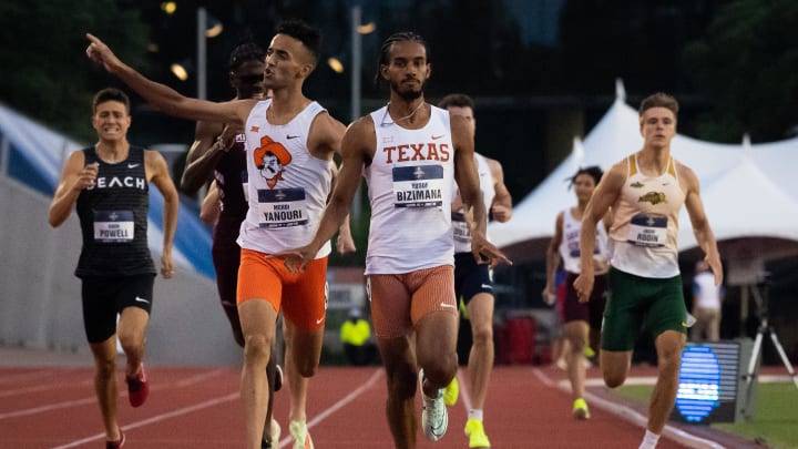 June 7, 2023; Austin, TX, USA; Texas runner Yusuf Bizimana and Oklahoma State runner Mehdi Yanouri celebrate their finishes in the 800 meter semifinals during the 2023 NCAA outdoor track and field championships June 7, 2023; Austin, TX, USA; Texas runner Yusuf Bizimana and Oklahoma State runner Mehdi Yanouri celebrate their finishes in the 800 meter semifinals during the 2023 NCAA outdoor track and field championships