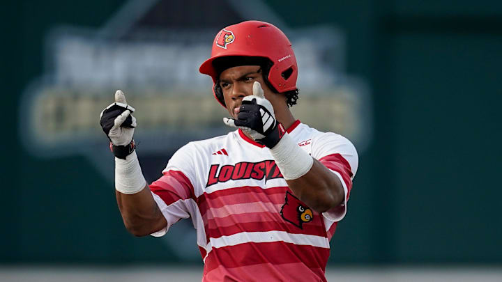 Louisville designated hitter Zion Rose (32) celebrates his RBI-double against Vanderbilt during the first inning at Hawkins Field in Nashville, Tenn., Tuesday, May 7, 2024.