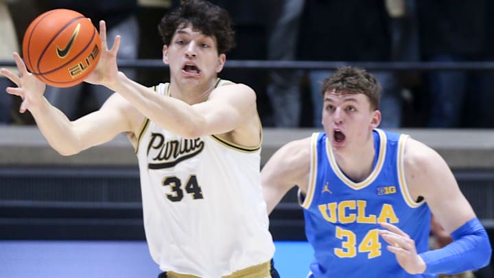 Purdue Boilermakers forward Raleigh Burgess (34) catches a pass while being defended by UCLA Bruins forward Tyler Bilodeau (34) Friday, Feb. 28, 2025, during the NCAA men’s basketball game at Mackey Arena in West Lafayette, Ind. Purdue Boilermakers forward Raleigh Burgess (34) catches a pass while being defended by UCLA Bruins forward Tyler Bilodeau (34) Friday, Feb. 28, 2025, during the NCAA men’s basketball game at Mackey Arena in West Lafayette, Ind.