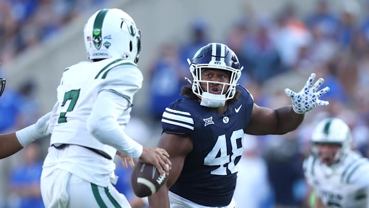 Aug 30, 2025; Provo, Utah, USA; Brigham Young Cougars defensive end Bodie Schoonover (48) pressures Portland State Vikings quarterback CJ Jordan (7) during the second quarter at LaVell Edwards Stadium. Mandatory Credit: Rob Gray-Imagn Images