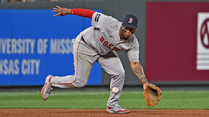 Aug 5, 2024; Kansas City, Missouri, USA; Boston Red Sox third baseman Rafael Devers (11) fields a ground ball in the eighth inning against the Kansas City Royals at Kauffman Stadium. Mandatory Credit: Peter Aiken-Imagn Images Aug 5, 2024; Kansas City, Missouri, USA; Boston Red Sox third baseman Rafael Devers (11) fields a ground ball in the eighth inning against the Kansas City Royals at Kauffman Stadium. Mandatory Credit: Peter Aiken-Imagn Images