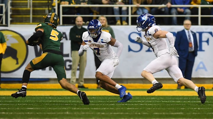 North Dakota State Bison wide receiver Bryce Lance (5) evades South Dakota State Jackrabbits cornerback Dalys Beanum (7) on Saturday, Dec. 21, 2024, at Fargodome in Fargo, North Dakota.