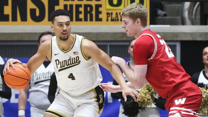 Purdue Boilermakers forward Trey Kaufman-Renn (4) drives into Wisconsin Badgers forward Steven Crowl (22) 