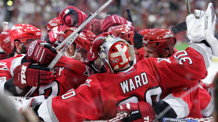 June 1, 2006; Raleigh, NC, USA; Carolina Hurricanes  team congratulate goaltender (30) Cam Ward as the Carolina Hurricanes defeated the Buffalo Sabres 4-2 in game 7 of the NHL Eastern Conference Final at the RBC Center.  Mandatory Credit: James Guillory-Imagn Images Copyright (c) 2006 James Guillory