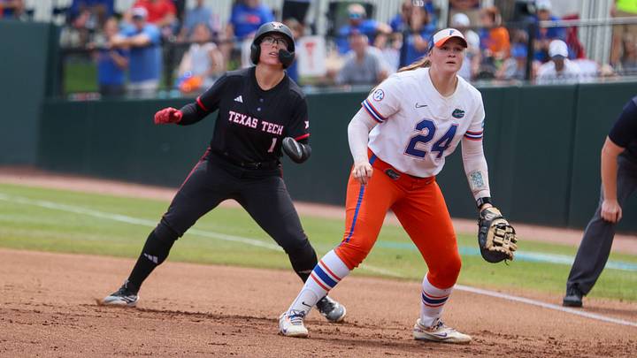 Florida infielder Madison Walker (24) looks for the throw while Texas Tech second baseman Mia Williams (1) contemplates a steal during game 3 of the super regional of the NCAA Division 1 softball championship at Katie Seashole Pressly Stadium in Gainesville, FL on Sunday, May 24, 2026. [Alan Youngblood/Gainesville Sun]