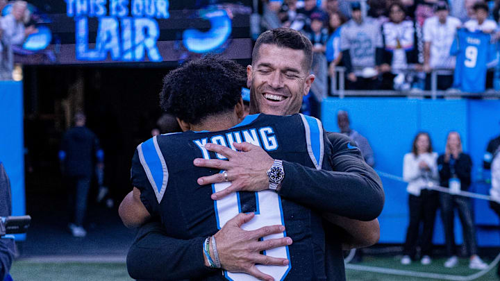 Nov 3, 2024; Charlotte, North Carolina, USA; Carolina Panthers head coach Dave Canales hugs quarterback Bryce Young (9) after getting the win against the New Orleans Saints at Bank of America Stadium. Mandatory Credit: Scott Kinser-Imagn Images Nov 3, 2024; Charlotte, North Carolina, USA; Carolina Panthers head coach Dave Canales hugs quarterback Bryce Young (9) after getting the win against the New Orleans Saints at Bank of America Stadium. Mandatory Credit: Scott Kinser-Imagn Images