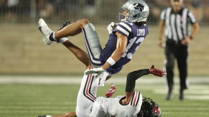 Kansas State sophomore wide receiver Xavier Loyd (13) rolls over Southeast Missouri State cornerback Ty Leonard in the third quarter of Saturday's game inside Bill Snyder Family Stadium.