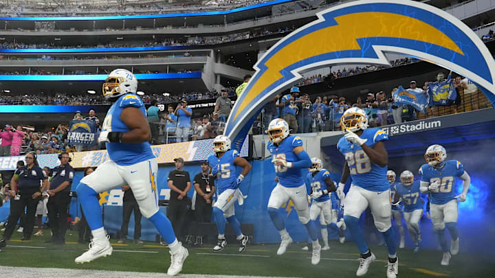 Oct 29, 2023; Inglewood, California, USA; Los Angeles Chargers offensive tackle Trey Pipkins III (79), linebacker Tuli Tuipulotu (45), quarterback Justin Herbert (10) and running back Isaiah Spiller (28) enter the field before the game against the Chicago Bears at SoFi Stadium