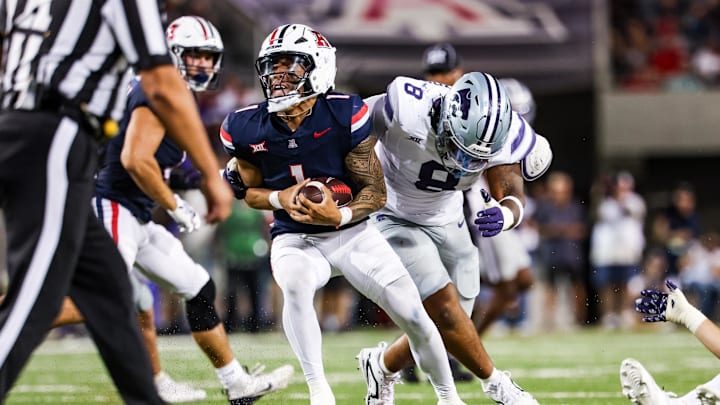 Sep 12, 2025; Tucson, Arizona, USA; Kansas State Wildcats defensive end Chiddi Obiazor (8) tackles Arizona Wildcats quarterback Noah Fifita (1) during the third quarter of the game at Arizona Stadium. Mandatory Credit: Aryanna Frank-Imagn Images Sep 12, 2025; Tucson, Arizona, USA; Kansas State Wildcats defensive end Chiddi Obiazor (8) tackles Arizona Wildcats quarterback Noah Fifita (1) during the third quarter of the game at Arizona Stadium. Mandatory Credit: Aryanna Frank-Imagn Images