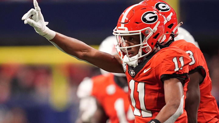 Georgia Bulldogs linebacker Jalon Walker reacts against the Texas Longhorns during the first half in the SEC Championship. Georgia Bulldogs linebacker Jalon Walker reacts against the Texas Longhorns during the first half in the SEC Championship.