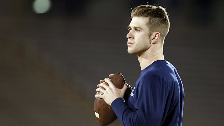 Nov 22, 2014; East Hartford, CT, USA; Connecticut Huskies quarterback Chandler Whitmer (10) warms up before the start of the game against the Cincinnati Bearcats at Rentschler Field. Mandatory Credit: David Butler II-Imagn Images