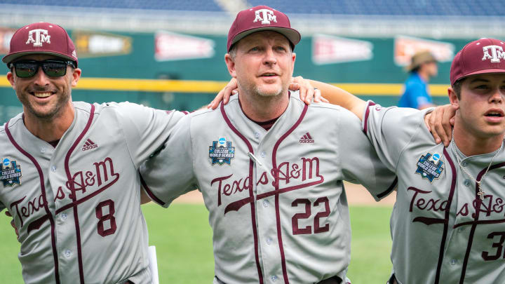 Jun 21, 2022; Omaha, NE, USA; Texas A&M head coach Jim Schlossnagle (22) celebrates the win over the Notre Dame Fighting Irish at Charles Schwab Field. 