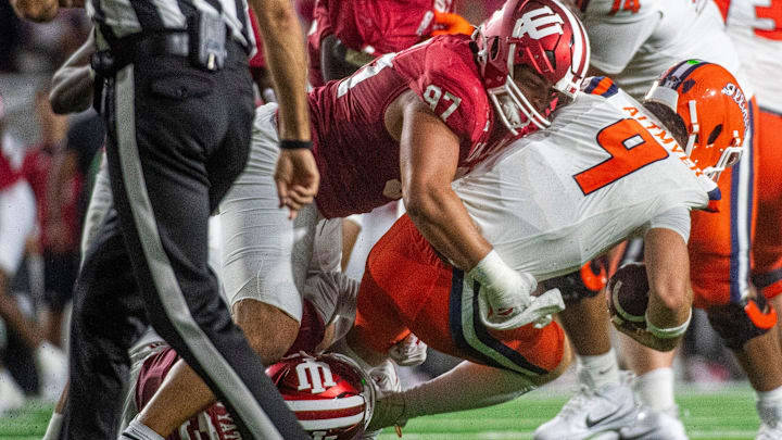Indiana's Mario Landino (97) and Kellen Wyatt (13) sacks Illinois' Luke Altmeyer (9) during the Indiana versus Illinois football game at Memorial Stadium on Saturday, Sept. 20, 2025