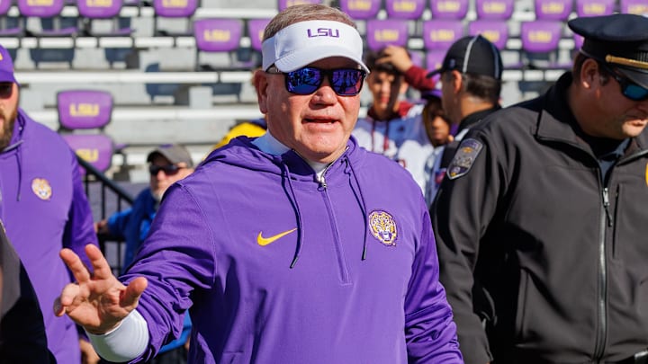 Nov 25, 2023; Baton Rouge, Louisiana, USA;  LSU Tigers head coach Brian Kelly waves to fans during warmups before the game against the Texas A&M Aggies at Tiger Stadium. Mandatory Credit: Stephen Lew-USA TODAY Sports