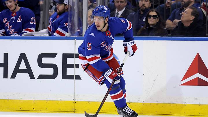 Oct 19, 2026; New York, New York, USA; New York Rangers defenseman Sean Durzi (5) skates with the puck against the Anaheim Ducks during the first period at Madison Square Garden. Mandatory Credit: Brad Penner-Imagn Images Oct 19, 2026; New York, New York, USA; New York Rangers defenseman Sean Durzi (5) skates with the puck against the Anaheim Ducks during the first period at Madison Square Garden. Mandatory Credit: Brad Penner-Imagn Images
