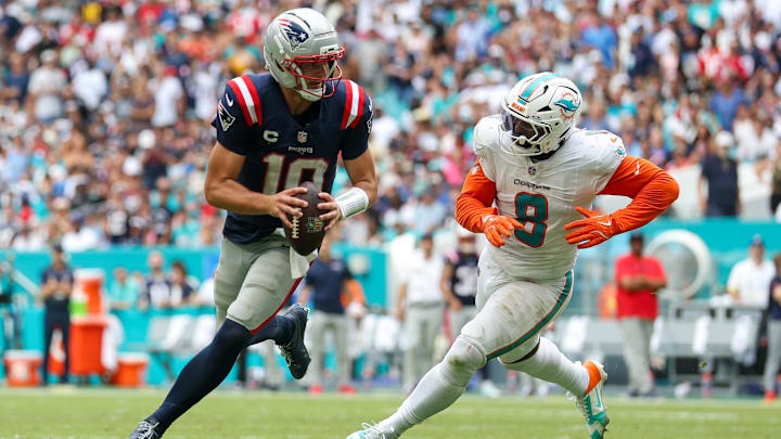 New England Patriots quarterback Drake Maye (10) runs the ball chased by Miami Dolphins linebacker Matthew Judon (8) in the third quarter at Hard Rock Stadium. New England Patriots quarterback Drake Maye (10) runs the ball chased by Miami Dolphins linebacker Matthew Judon (8) in the third quarter at Hard Rock Stadium.