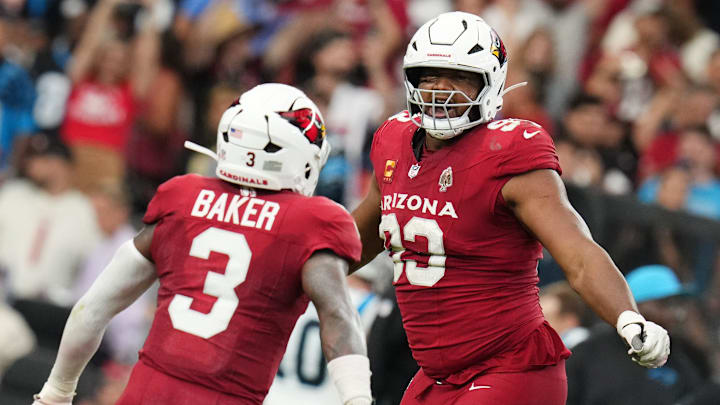 Arizona Cardinals defensive lineman Calais Campbell (93) celebrates his sack with teammate Budda Baker (3) as they play against the Carolina Panthers at State Farm Stadium on Sept 14, 2025.