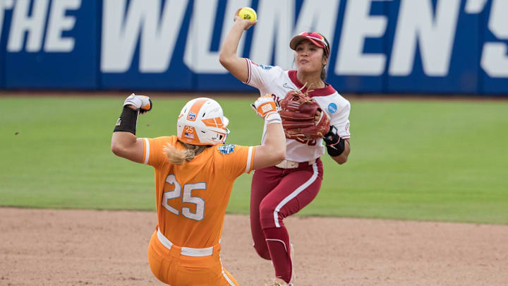 Oklahoma Sooners second baseman Ailana Agbayani helps turn a double play in the seventh inning on Thursday against Tennessee. Oklahoma Sooners second baseman Ailana Agbayani helps turn a double play in the seventh inning on Thursday against Tennessee.