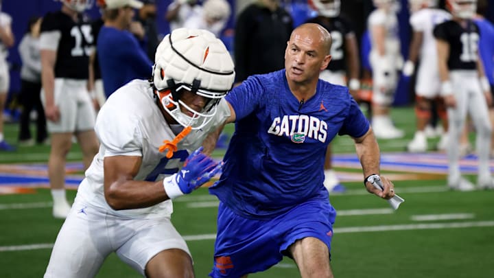 Florida Gators freshman receiver Dallas Wilson works on separation with assistant coach Billy Gonzales. Florida Gators freshman receiver Dallas Wilson works on separation with assistant coach Billy Gonzales.