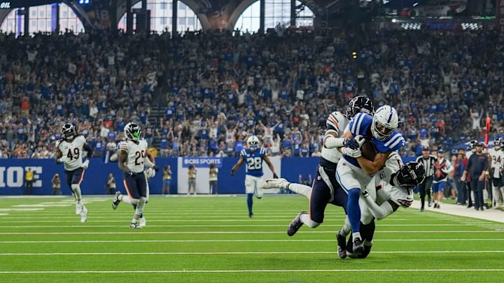 Chicago Bears cornerback Tyrique Stevenson (29) brings down Indianapolis Colts wide receiver Alec Pierce (14) after a deep pass Sunday, Sept. 22, 2024, during a game against the Chicago Bears at Lucas Oil Stadium in Indianapolis.