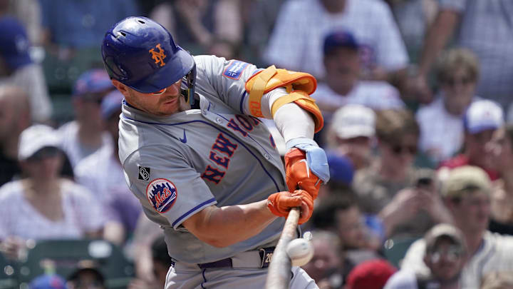 Jun 22, 2024; Chicago, Illinois, USA; New York Mets first baseman Pete Alonso (20) hits a single against the Chicago Cubs during the sixth inning at Wrigley Field. Jun 22, 2024; Chicago, Illinois, USA; New York Mets first baseman Pete Alonso (20) hits a single against the Chicago Cubs during the sixth inning at Wrigley Field.