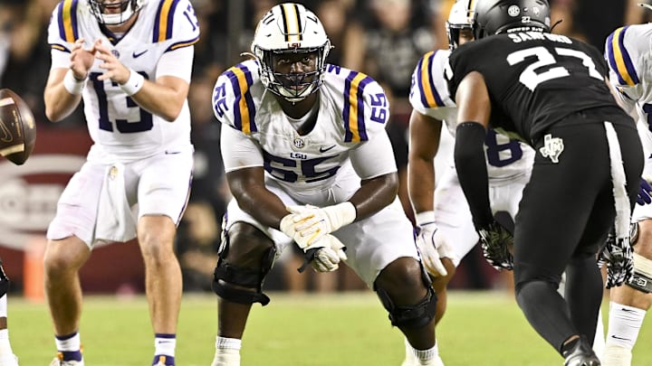 Oct 26, 2024; College Station, Texas, USA; LSU Tigers offensive lineman Paul Mubenga (65) lines up during the second half against the Texas A&M Aggies. The Aggies defeated the Tigers 38-23; at Kyle Field. Mandatory Credit: Maria Lysaker-Imagn Images. Oct 26, 2024; College Station, Texas, USA; LSU Tigers offensive lineman Paul Mubenga (65) lines up during the second half against the Texas A&M Aggies. The Aggies defeated the Tigers 38-23; at Kyle Field. Mandatory Credit: Maria Lysaker-Imagn Images.