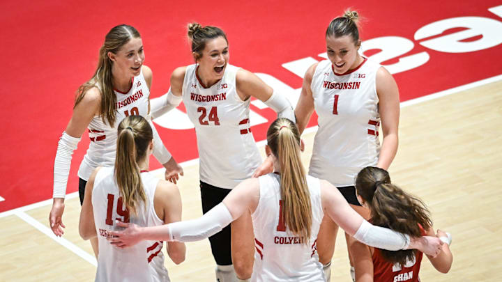 Wisconsin players Madison Quest (10), Charlie Fuerbringer (24), Ana Vajagic (1), Maile Chan (18), Mimi Colyer (15) and Tosia Serafinowska (19) celebrate match point against Marquette in a spring match Wednesday, April 16, 2025, at the UW Field House in Madison, Wisconsin.