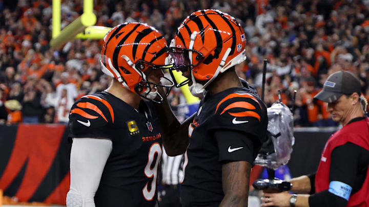 Dec 28, 2024; Cincinnati, Ohio, USA; Cincinnati Bengals quarterback Joe Burrow (9) celebrates following his touchdown pass to wide receiver Tee Higgins (5) during the fourth quarter against the Denver Broncos at Paycor Stadium. Mandatory Credit: Joseph Maiorana-Imagn Images Dec 28, 2024; Cincinnati, Ohio, USA; Cincinnati Bengals quarterback Joe Burrow (9) celebrates following his touchdown pass to wide receiver Tee Higgins (5) during the fourth quarter against the Denver Broncos at Paycor Stadium. Mandatory Credit: Joseph Maiorana-Imagn Images