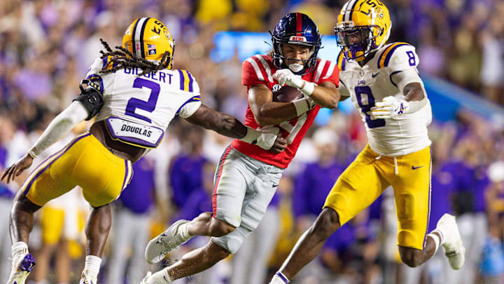 Oct 12, 2024; Baton Rouge, Louisiana, USA; Mississippi Rebels wide receiver Cayden Lee (19) is tackled by LSU Tigers safety Jardin Gilbert (2) during the second half at Tiger Stadium. Mandatory Credit: Stephen Lew-Imagn Images Oct 12, 2024; Baton Rouge, Louisiana, USA; Mississippi Rebels wide receiver Cayden Lee (19) is tackled by LSU Tigers safety Jardin Gilbert (2) during the second half at Tiger Stadium. Mandatory Credit: Stephen Lew-Imagn Images