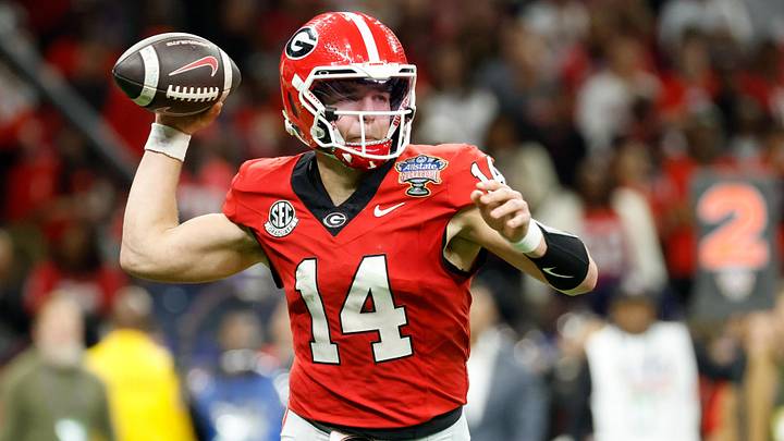 Jan 1, 2026; New Orleans, LA, USA; Georgia Bulldogs quarterback Gunner Stockton (14) passes the ball against the Mississippi Rebels in the second quarter during the 2026 Sugar Bowl and quarterfinal game of the College Football Playoff at Caesars Superdome. Mandatory Credit: Amber Searls-Imagn Images