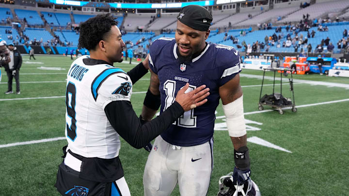 Dec 15, 2024; Charlotte, North Carolina, USA; Carolina Panthers quarterback Bryce Young (9) with Dallas Cowboys linebacker Micah Parsons (11) after the game at Bank of America Stadium. Dec 15, 2024; Charlotte, North Carolina, USA; Carolina Panthers quarterback Bryce Young (9) with Dallas Cowboys linebacker Micah Parsons (11) after the game at Bank of America Stadium.