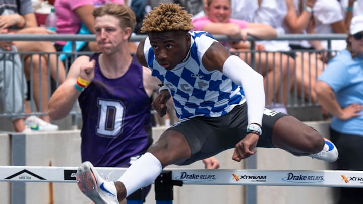 Clear Creek Amana's Tay Seals competes in the 3A shuttle hurdle relay final during the 2025 Iowa high school state track and field meet at Drake Stadium on May 24, 2025, in Des Moines. Clear Creek Amana's Tay Seals competes in the 3A shuttle hurdle relay final during the 2025 Iowa high school state track and field meet at Drake Stadium on May 24, 2025, in Des Moines.